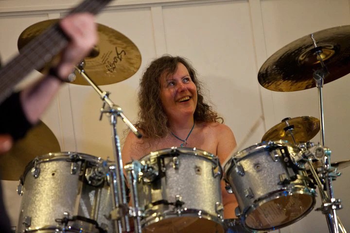 Penny Larson in a duo setting — laughing mid-performance
