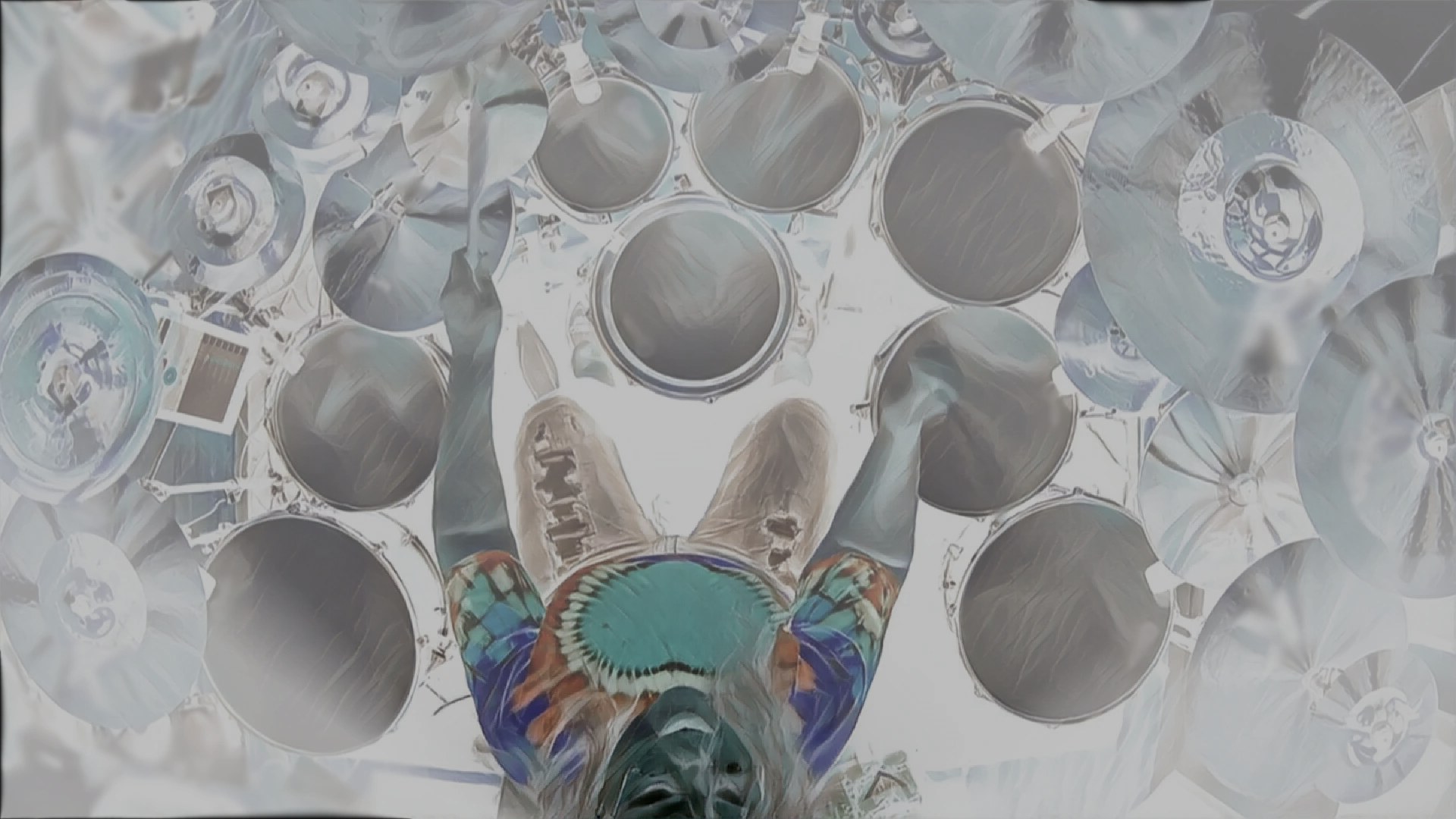 Overhead view of Penny Larson playing a large multi-percussion setup