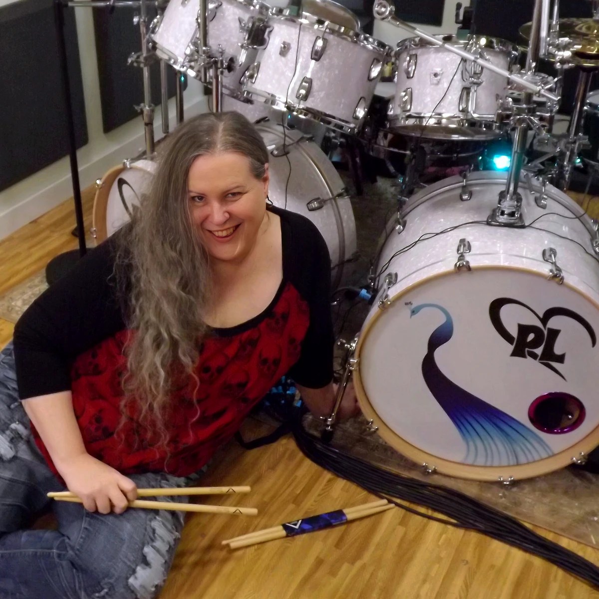 Penny Larson in her drum studio with her custom kit